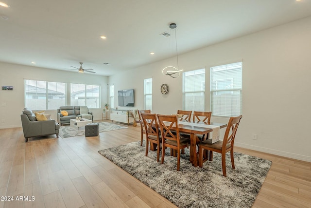 dining room featuring ceiling fan and light hardwood / wood-style flooring