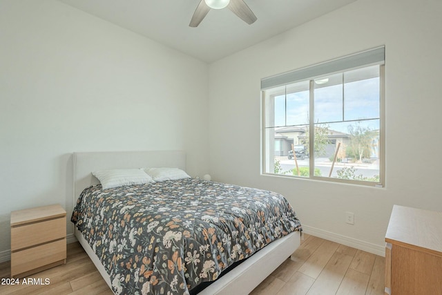 bedroom featuring ceiling fan and light hardwood / wood-style flooring