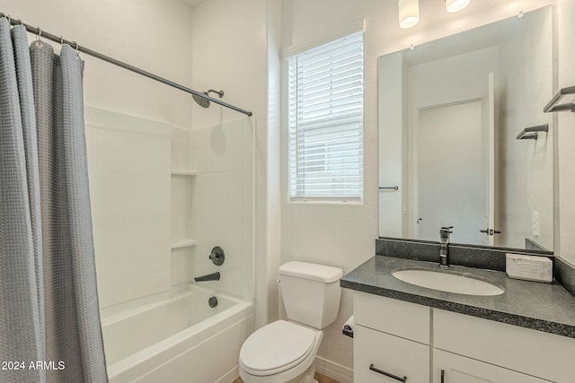 full bathroom with vanity, shower / bath combo, and toilet