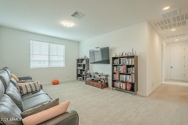 living room featuring light carpet