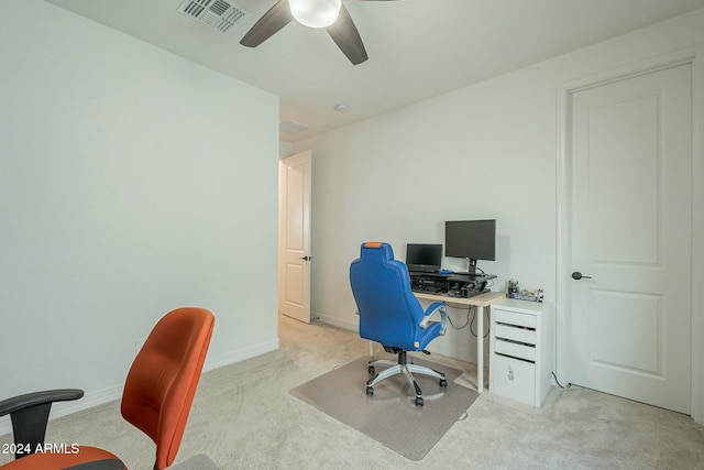 carpeted home office with ceiling fan