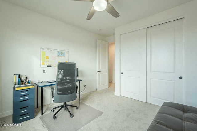 home office featuring ceiling fan and light carpet