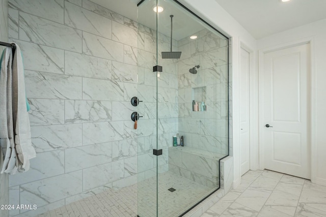 bathroom with a shower with shower door