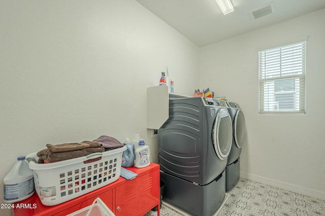 clothes washing area featuring washing machine and dryer