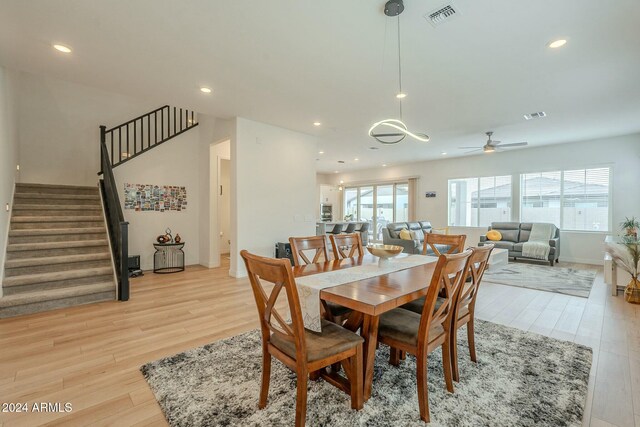 dining area featuring ceiling fan and light hardwood / wood-style floors