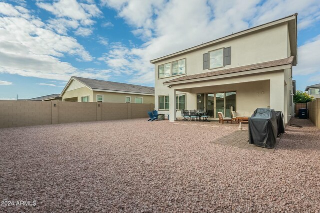 back of property with a patio area