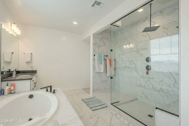 bathroom featuring separate shower and tub and vanity