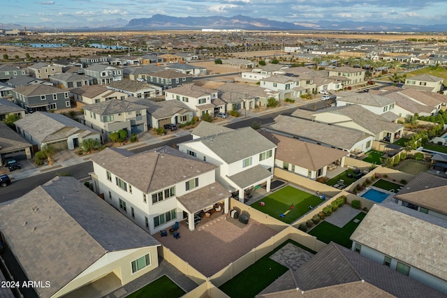 birds eye view of property featuring a mountain view