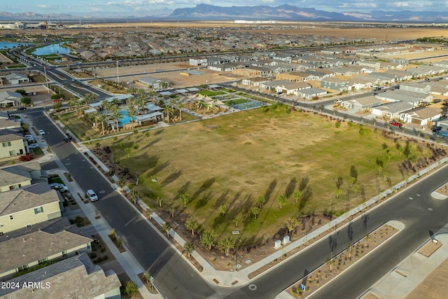 birds eye view of property with a mountain view