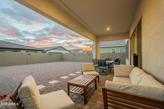 patio terrace at dusk with outdoor lounge area