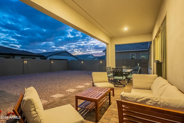 patio terrace at dusk with outdoor lounge area