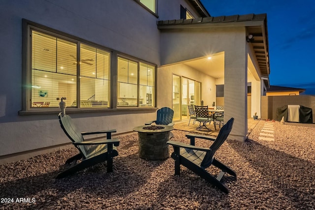 back of house with a patio area and a fire pit