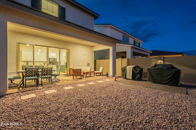 back of house with outdoor lounge area and a patio area