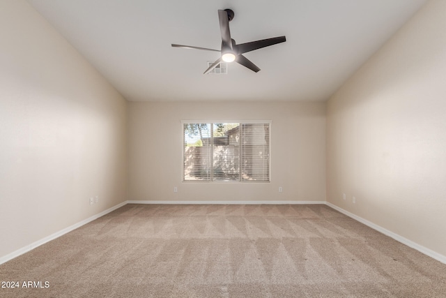 empty room featuring light carpet and ceiling fan