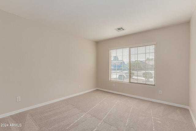 empty room with light colored carpet