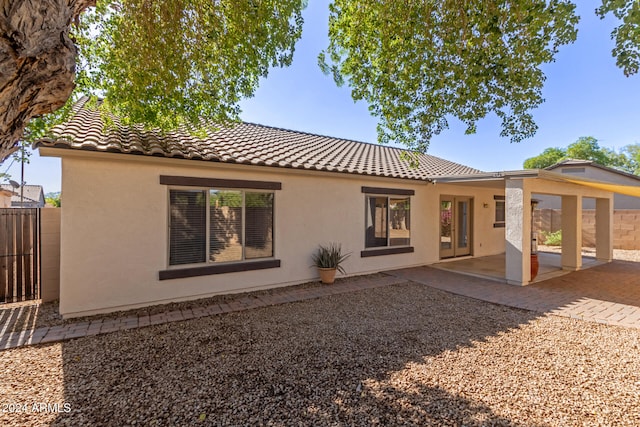 back of property featuring a patio