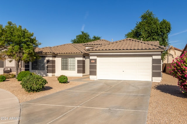 mediterranean / spanish house featuring a garage