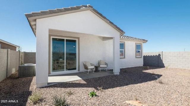 12438 E Verbina Ln, Florence, AZ 85132 - back of house with stucco siding, a fenced backyard, a patio, and a tile roof