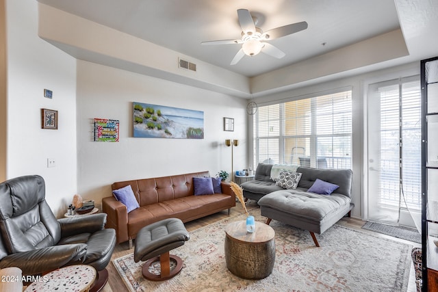 living room with ceiling fan and wood-type flooring