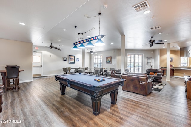 game room featuring a textured ceiling, hardwood / wood-style flooring, ceiling fan, and billiards