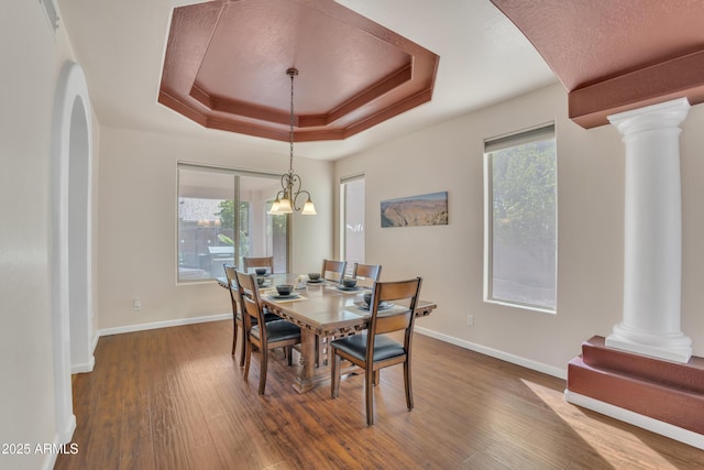 2642 S Joplin, Mesa, AZ 85209 - dining area with ornate columns, a raised ceiling, and wood finished floors