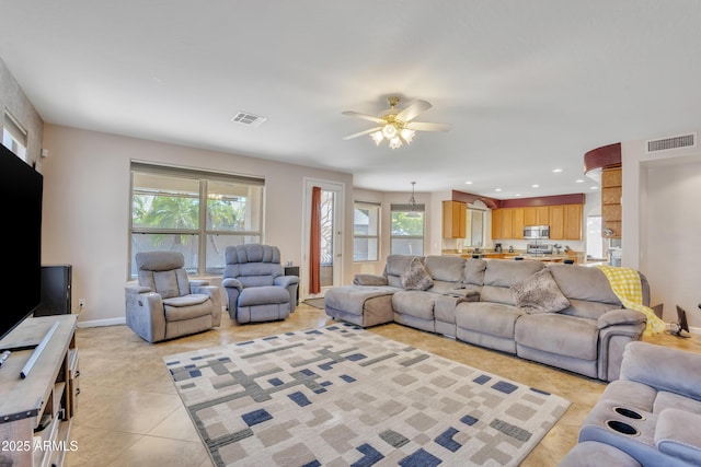 2642 S Joplin, Mesa, AZ 85209 - living area with light tile patterned flooring, ceiling fan, and plenty of natural light