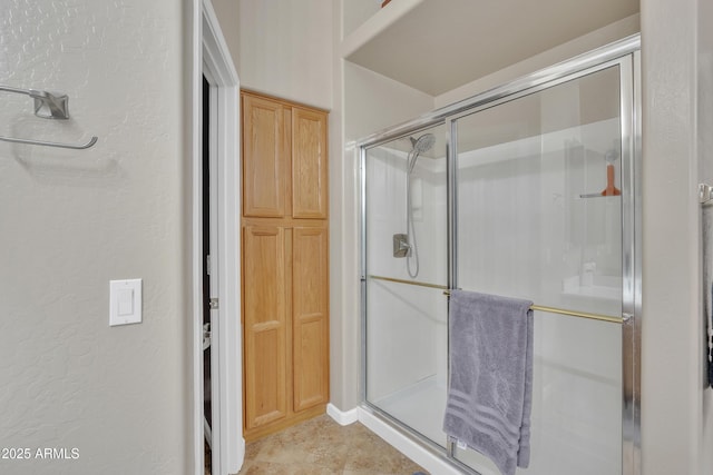 2642 S Joplin, Mesa, AZ 85209 - bathroom with a shower stall, tile patterned floors, and a textured wall