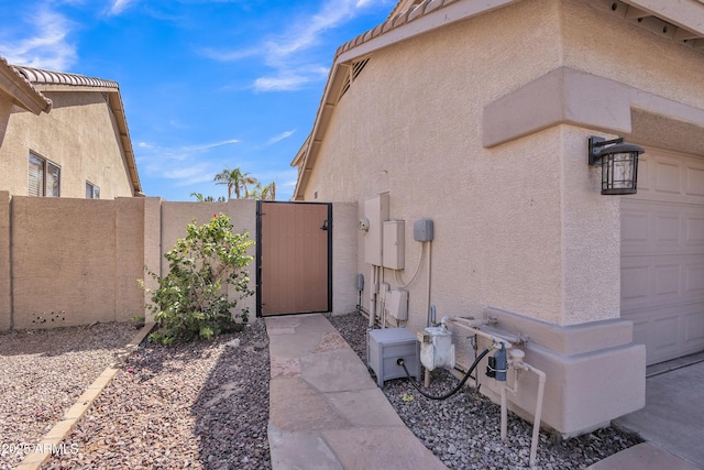 2642 S Joplin, Mesa, AZ 85209 - view of property exterior featuring a gate and stucco siding