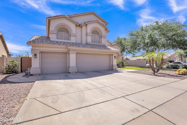 2642 S Joplin, Mesa, AZ 85209 - mediterranean / spanish-style house with stucco siding, an attached garage, a tiled roof, and driveway