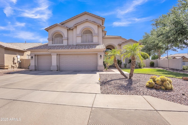 2642 S Joplin, Mesa, AZ 85209 - mediterranean / spanish house featuring stucco siding, driveway, an attached garage, and a tile roof