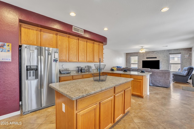 2642 S Joplin, Mesa, AZ 85209 - kitchen with stainless steel refrigerator with ice dispenser, a ceiling fan, open floor plan, light tile patterned floors, and a center island