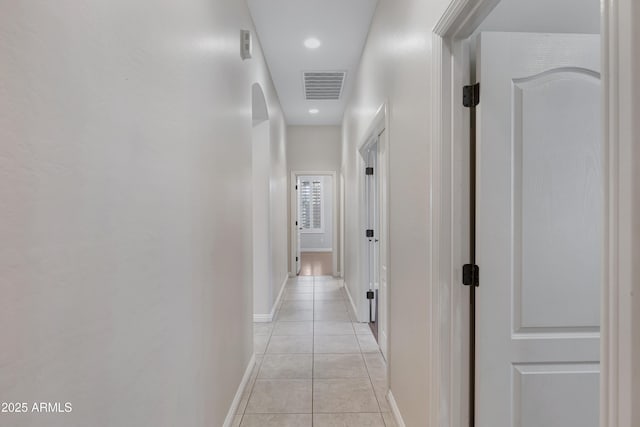 corridor with light tile patterned floors