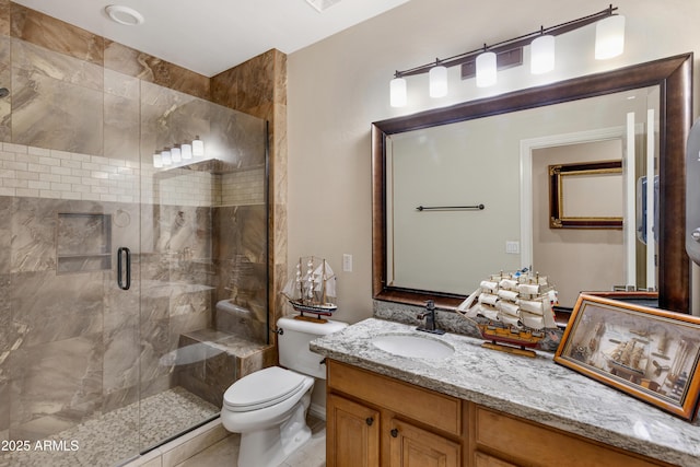 bathroom with toilet, tile patterned flooring, a shower with shower door, and vanity