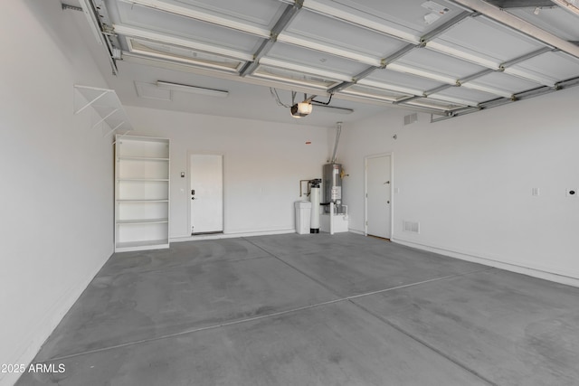 garage with a garage door opener and water heater