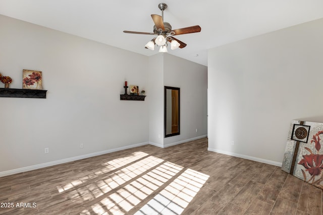 empty room with hardwood / wood-style floors and ceiling fan