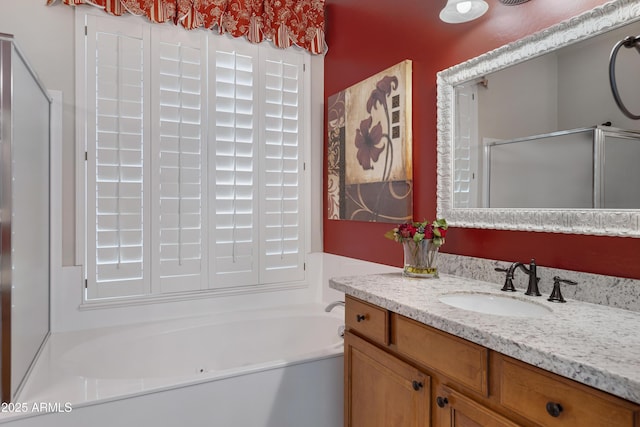 bathroom featuring independent shower and bath and vanity