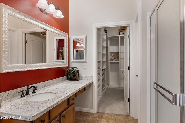 bathroom with tile patterned flooring and vanity