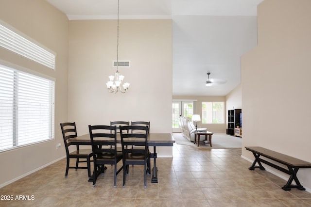 5451 W Folley St, Chandler, AZ 85226 - dining area with a towering ceiling, a chandelier, baseboards, and light tile patterned floors