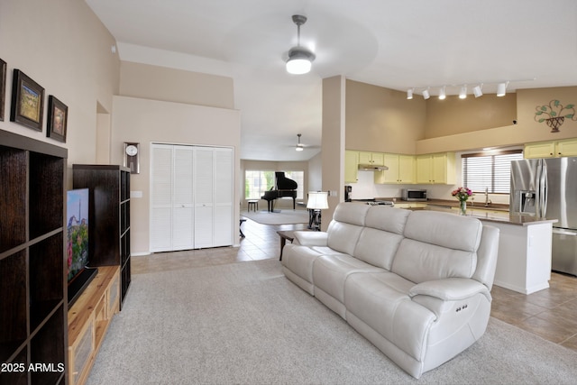 5451 W Folley St, Chandler, AZ 85226 - living room with a high ceiling, light tile patterned flooring, a ceiling fan, track lighting, and plenty of natural light