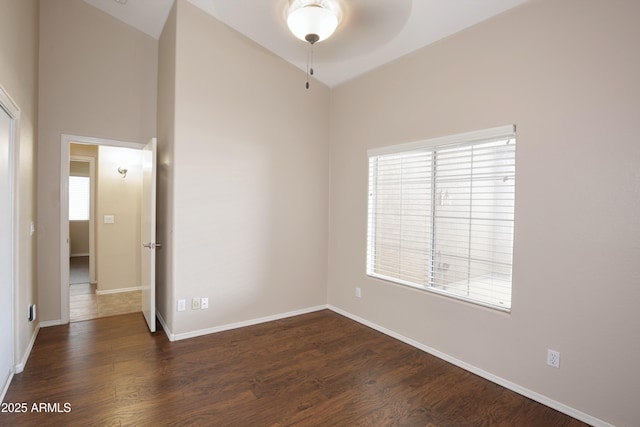 5451 W Folley St, Chandler, AZ 85226 - empty room featuring ceiling fan, dark wood-style floors, baseboards, and high vaulted ceiling