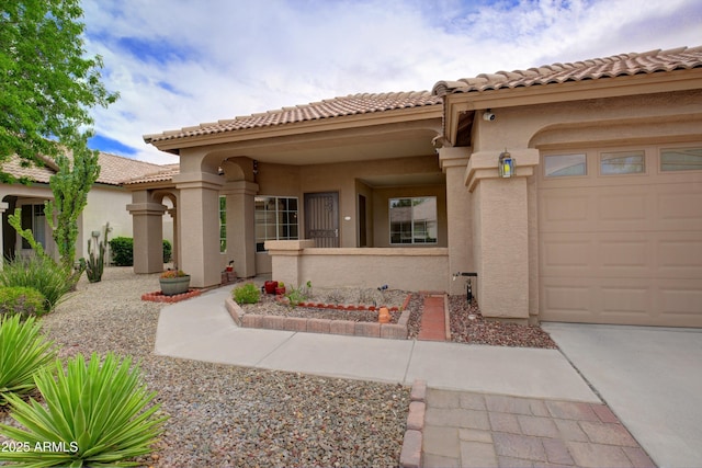 5451 W Folley St, Chandler, AZ 85226 - view of front facade featuring stucco siding, an attached garage, a tiled roof, and driveway