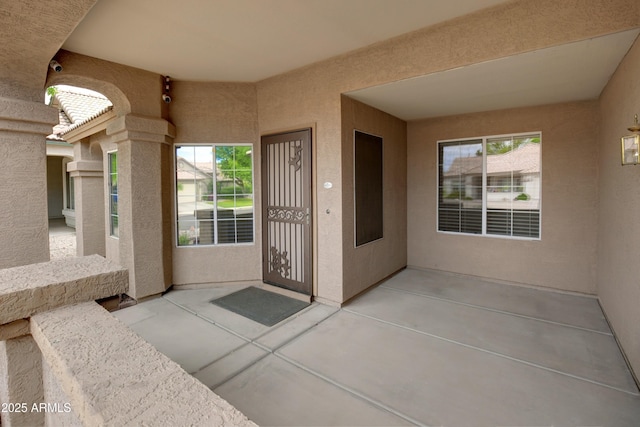 5451 W Folley St, Chandler, AZ 85226 - doorway to property with stucco siding and a patio area