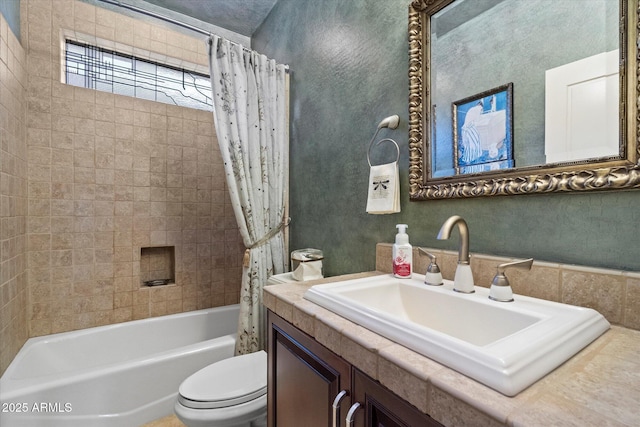 bathroom with vanity, shower / bath combo with shower curtain, and toilet