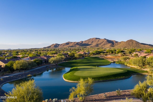 surrounding community with a water and mountain view, golf course view, and a residential view