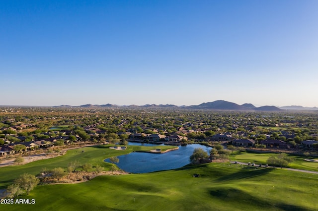 drone / aerial view with a residential view, a water and mountain view, and golf course view