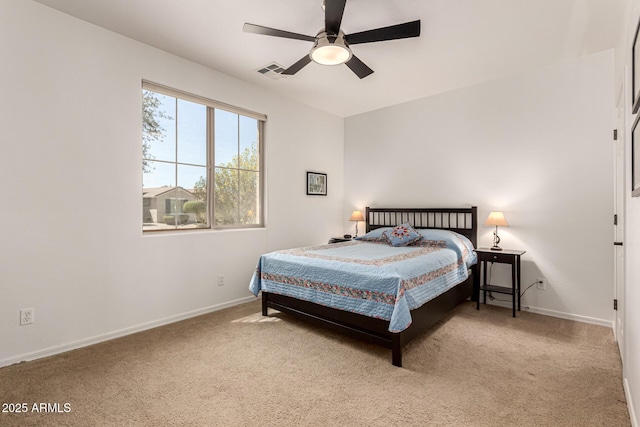 carpeted bedroom featuring visible vents, baseboards, and a ceiling fan