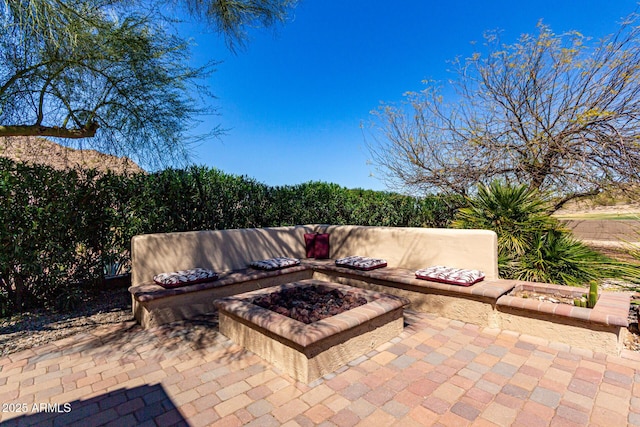 view of patio with a fire pit