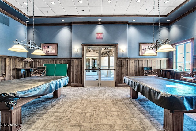 game room featuring visible vents, pool table, carpet, a wainscoted wall, and wood walls