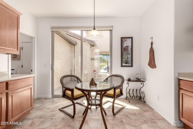 dining area featuring baseboards