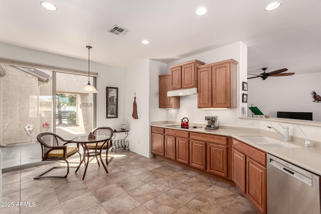 kitchen with dishwasher, light countertops, under cabinet range hood, and a sink